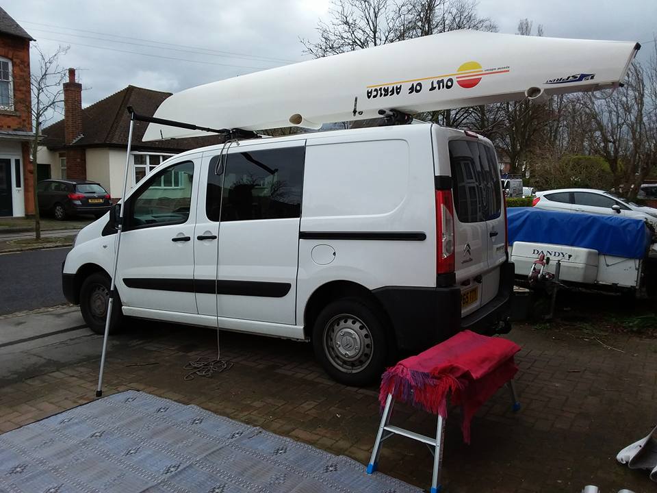 Lifted bow onto roof, ready to slide forward for tie down
